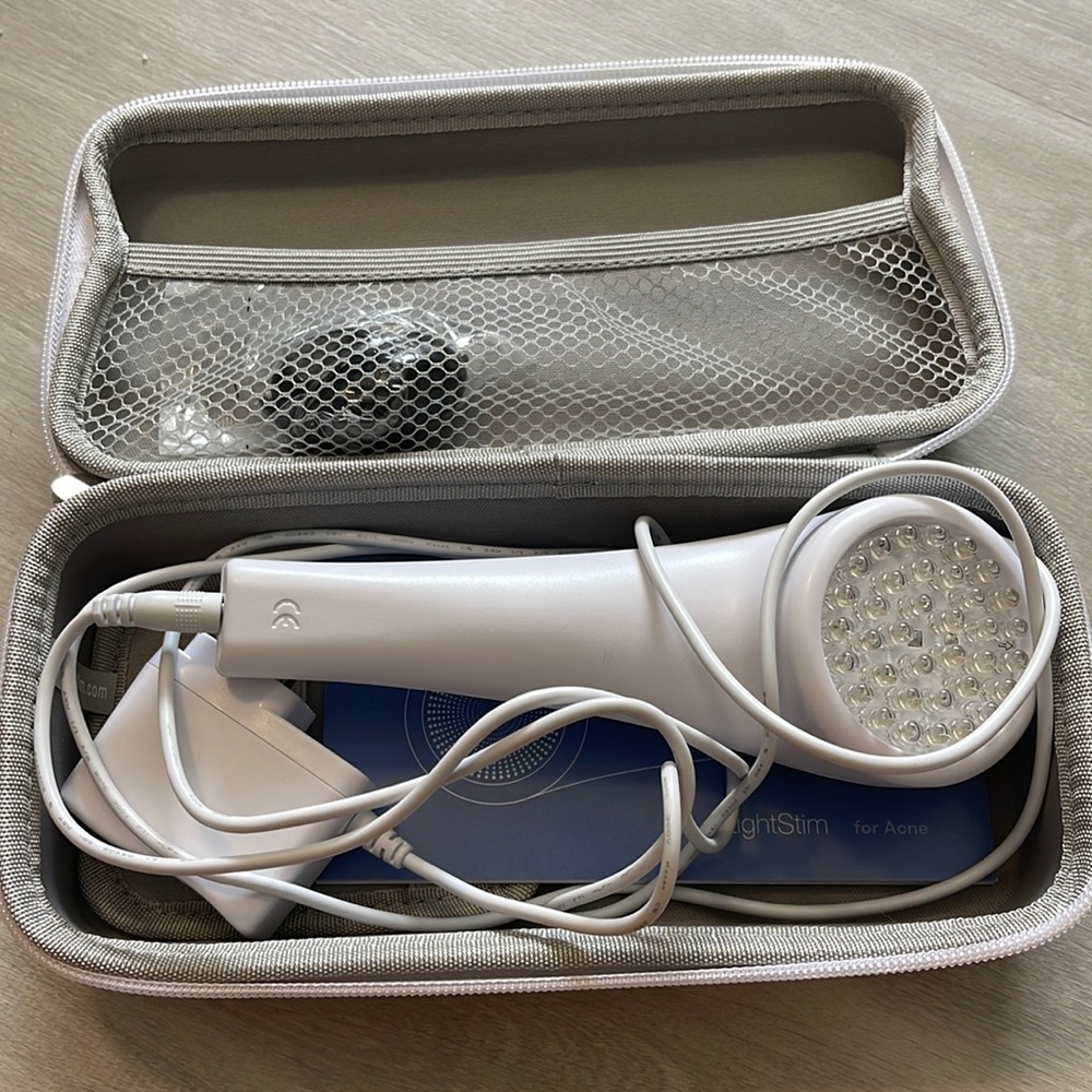 Light Stim for acne with carry case, charger, directions and goggles.